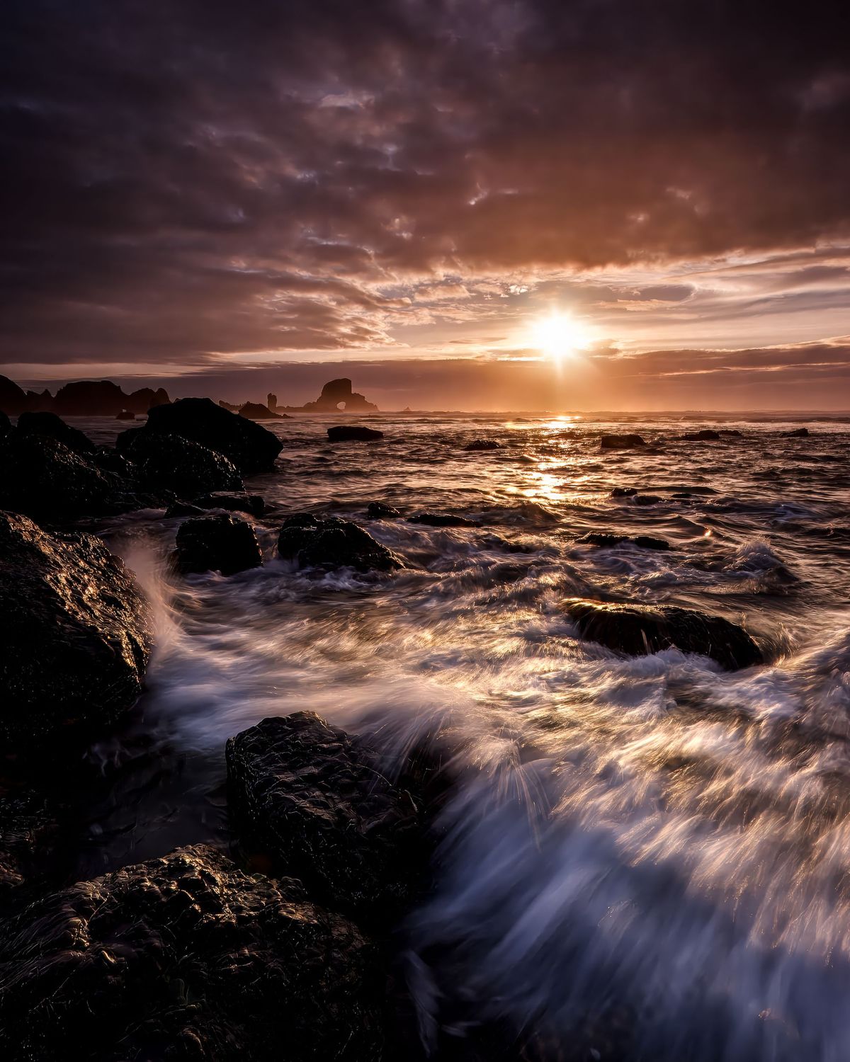 Waves cascade over rock at Oregon Ecola State Park